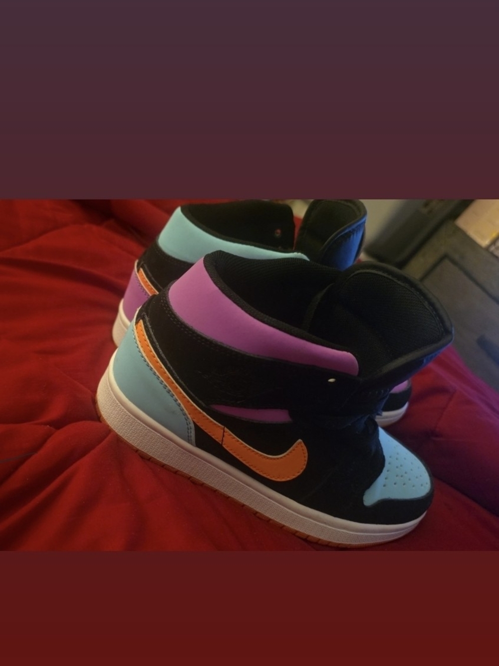 Kids Black High-Top Sneakers with Orange Swoosh and Pastel Accents
